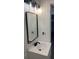 Modern bathroom with white vanity, black fixtures, and a large mirror at 5614 Read St, North Charleston, SC 29406