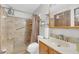 Updated bathroom with walk-in shower, built-in seat, and tiled walls at 8048 New England Dr, North Charleston, SC 29420