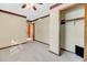 Bedroom with ceiling fan, neutral walls, and walk-in closet at 8048 New England Dr, North Charleston, SC 29420