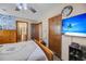 Bedroom with large TV, dresser, and ensuite bathroom access at 8048 New England Dr, North Charleston, SC 29420