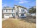 Two-story house with gray siding, brick steps, and a white garage door at 8048 New England Dr, North Charleston, SC 29420