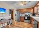 Eat-in kitchen, stainless steel appliances, and wood cabinets at 8048 New England Dr, North Charleston, SC 29420