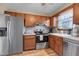 Modern kitchen with stainless steel appliances and wood cabinets at 8048 New England Dr, North Charleston, SC 29420