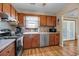 Kitchen features stainless steel appliances and wood cabinets at 8048 New England Dr, North Charleston, SC 29420