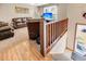 Top floor living area with leather furniture, TV, and access to balcony at 8048 New England Dr, North Charleston, SC 29420