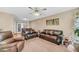 Living room with brown leather couches, a large TV, and a Christmas tree at 8048 New England Dr, North Charleston, SC 29420