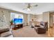 Living room with brown leather couches, TV, and Christmas tree at 8048 New England Dr, North Charleston, SC 29420