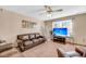 Living room with brown leather couches, a large TV, and a Christmas tree at 8048 New England Dr, North Charleston, SC 29420