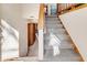 Staircase with carpeted steps and wooden railings at 8048 New England Dr, North Charleston, SC 29420