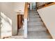 Staircase with carpeted steps and wooden railings at 8048 New England Dr, North Charleston, SC 29420