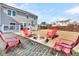 Fire pit and seating area surrounded by a fenced-in yard at 9736 Black Willow Ln, Ladson, SC 29456