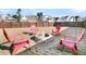 Fire pit with seating in a fenced-in backyard at 9736 Black Willow Ln, Ladson, SC 29456