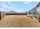 Backyard with firepit and partial view of home at 9736 Black Willow Ln, Ladson, SC 29456