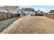 Large backyard with fire pit, deck, and privacy fence at 9736 Black Willow Ln, Ladson, SC 29456