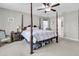 Spacious bedroom with a large four-poster bed and ample floor space at 9736 Black Willow Ln, Ladson, SC 29456