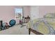 Bedroom with a bed, exercise bike, and weights at 9736 Black Willow Ln, Ladson, SC 29456