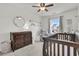 Bedroom with crib, dresser, and rocking chair at 9736 Black Willow Ln, Ladson, SC 29456