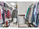 Walk-in closet with ample shelving and hanging space for clothes at 9736 Black Willow Ln, Ladson, SC 29456