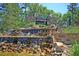 Community entrance featuring a waterfall and stone signage at 9736 Black Willow Ln, Ladson, SC 29456