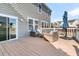 Spacious deck with seating area and access to the home's interior at 9736 Black Willow Ln, Ladson, SC 29456