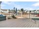 Relaxing deck with outdoor furniture, umbrella, and backyard view at 9736 Black Willow Ln, Ladson, SC 29456