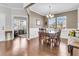 Traditional dining room with hardwood floors and white wainscoting at 9736 Black Willow Ln, Ladson, SC 29456