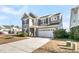 Two-story house with gray siding, white trim, and a two-car garage at 9736 Black Willow Ln, Ladson, SC 29456