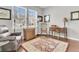Home office with hardwood floors, a comfortable chair, and built-in cabinetry at 9736 Black Willow Ln, Ladson, SC 29456