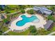 Community pool with lounge chairs and clubhouse at 9736 Black Willow Ln, Ladson, SC 29456