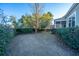 Landscaped backyard with mature trees and shrubs at 101 Ribbon Rd, Summerville, SC 29483