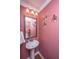 Charming powder room with pedestal sink and decorative accents at 101 Ribbon Rd, Summerville, SC 29483