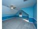 Spacious bedroom with blue walls, ceiling fan, and grey carpet at 101 Ribbon Rd, Summerville, SC 29483