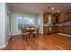 Kitchen breakfast nook with wood table and chairs near window at 101 Ribbon Rd, Summerville, SC 29483