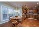 Bright breakfast nook features wood table and chairs, great for morning meals at 101 Ribbon Rd, Summerville, SC 29483