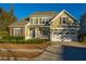 Two-story house with stone accents and a two-car garage at 101 Ribbon Rd, Summerville, SC 29483