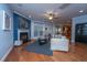Spacious living room with hardwood floors, fireplace, and built-in shelving at 101 Ribbon Rd, Summerville, SC 29483