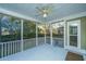 Covered porch with ceiling fan, screen enclosure, and view of backyard at 101 Ribbon Rd, Summerville, SC 29483