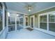 Screened porch with ceiling fan, adjacent to house exterior at 101 Ribbon Rd, Summerville, SC 29483