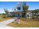 Charming clubhouse featuring a welcoming front porch at 1011 Swamp Harrier Ave, Ravenel, SC 29470