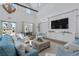 Bright and airy clubhouse lounge with large TV and seating at 1011 Swamp Harrier Ave, Ravenel, SC 29470