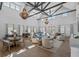 Spacious community room with high ceilings, chandeliers, and comfortable seating areas at 1011 Swamp Harrier Ave, Ravenel, SC 29470