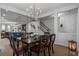 Elegant dining room with dark wood table and chandelier at 1011 Swamp Harrier Ave, Ravenel, SC 29470