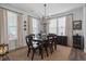 Formal dining room featuring a dark wood table and neutral color palette at 1011 Swamp Harrier Ave, Ravenel, SC 29470