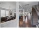 Bright and spacious entryway with hardwood floors and views into the dining and living areas at 1011 Swamp Harrier Ave, Ravenel, SC 29470