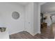 Bright and airy entryway with a circular mirror and ample floor space at 1011 Swamp Harrier Ave, Ravenel, SC 29470