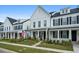 Row of charming two-story homes with white siding and black shutters at 1011 Swamp Harrier Ave, Ravenel, SC 29470