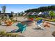 Community fire pit with colorful Adirondack chairs at 1011 Swamp Harrier Ave, Ravenel, SC 29470