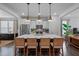 Modern kitchen with island, stainless steel appliances, and white shaker cabinets at 1011 Swamp Harrier Ave, Ravenel, SC 29470