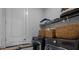 Laundry room with washer, dryer, shelving, and wicker baskets at 1011 Swamp Harrier Ave, Ravenel, SC 29470