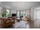 Open living room with hardwood floors and neutral decor at 1011 Swamp Harrier Ave, Ravenel, SC 29470